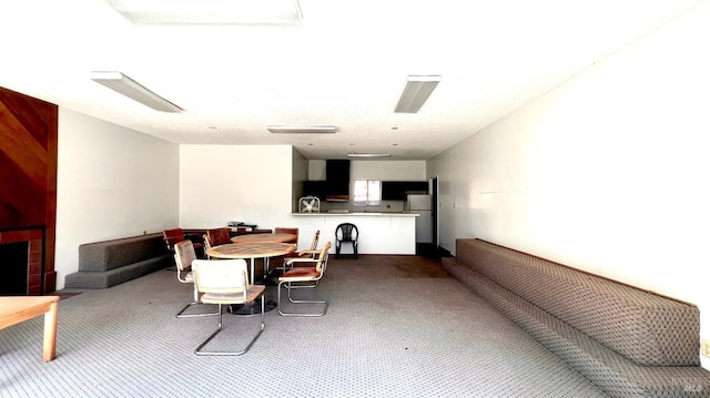 dining space featuring carpet