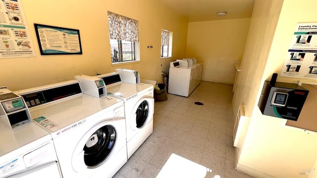 shared laundry area featuring washer and dryer