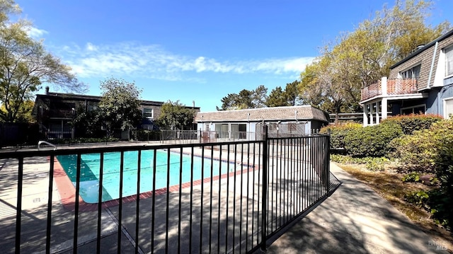 view of pool with a fenced in pool, a patio, and fence