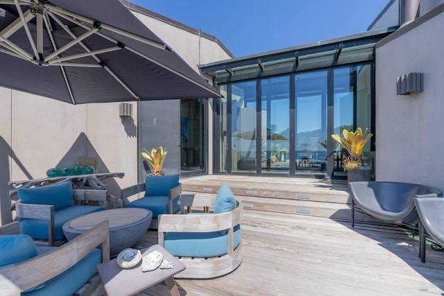 wooden deck featuring outdoor lounge area