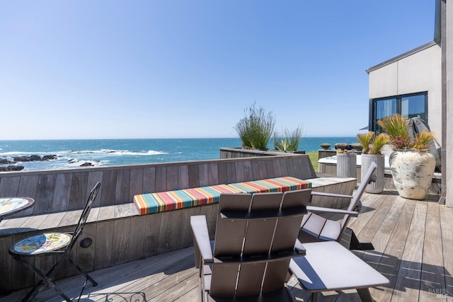 wooden deck with a water view