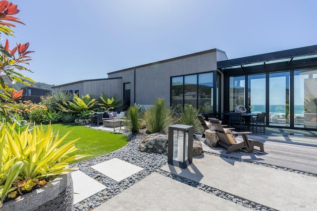 view of patio / terrace featuring outdoor lounge area, outdoor dining space, and a wooden deck