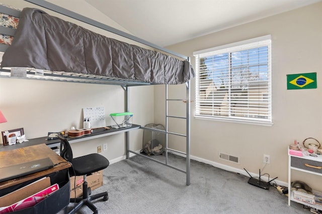 home office featuring lofted ceiling, carpet flooring, and baseboards