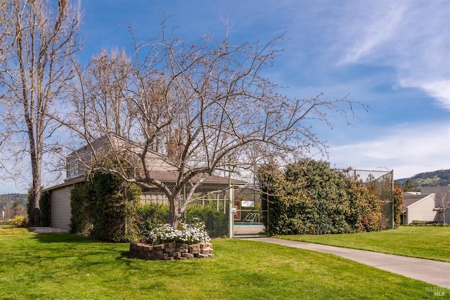 view of yard featuring fence and a gate