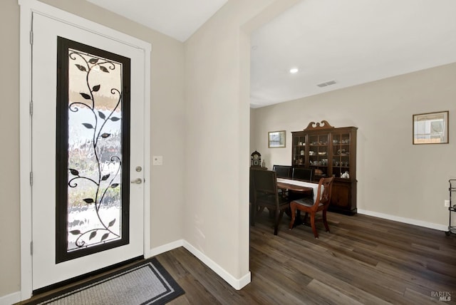 foyer featuring recessed lighting, baseboards, visible vents, and dark wood-style flooring