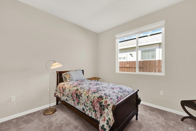 bedroom featuring carpet flooring and baseboards