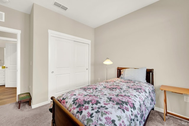 bedroom with carpet flooring, baseboards, and visible vents