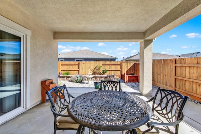 view of patio / terrace with outdoor dining area and a fenced backyard