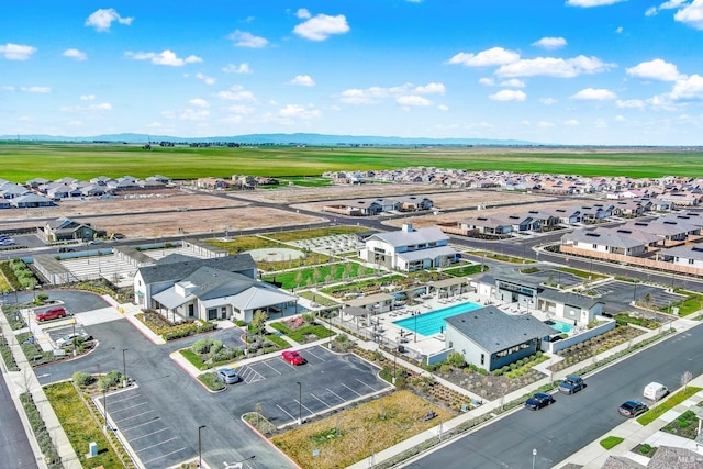 birds eye view of property with a residential view and a mountain view