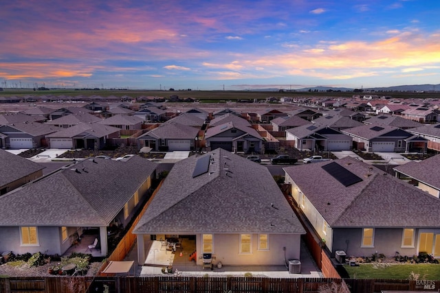 aerial view at dusk with a residential view