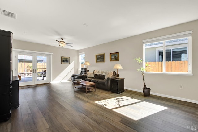 living room with visible vents, baseboards, ceiling fan, french doors, and wood finished floors