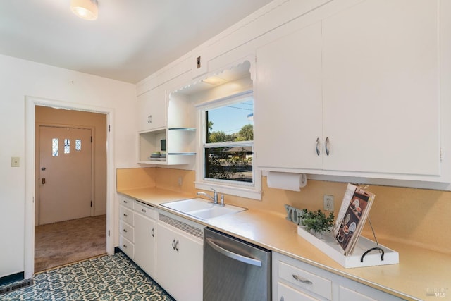 kitchen featuring white cabinets, dishwasher, light countertops, and a sink