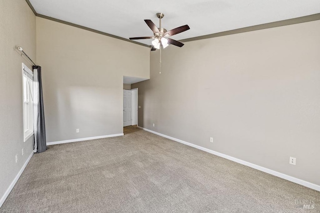 carpeted spare room featuring baseboards, high vaulted ceiling, and ceiling fan