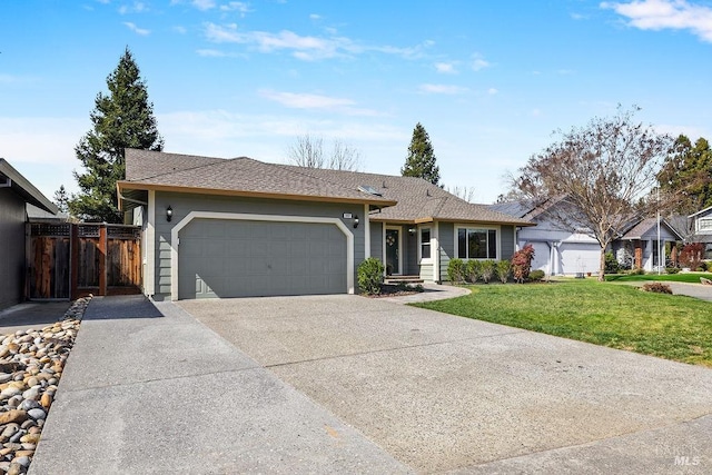 ranch-style house with a garage, a front yard, driveway, and fence