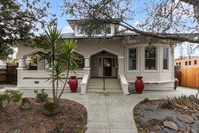 view of front of property featuring fence