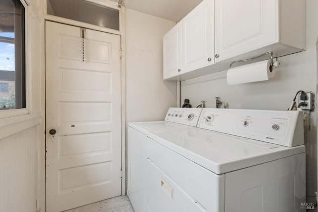 washroom featuring cabinet space and washer and dryer