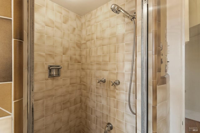 full bathroom with a tile shower