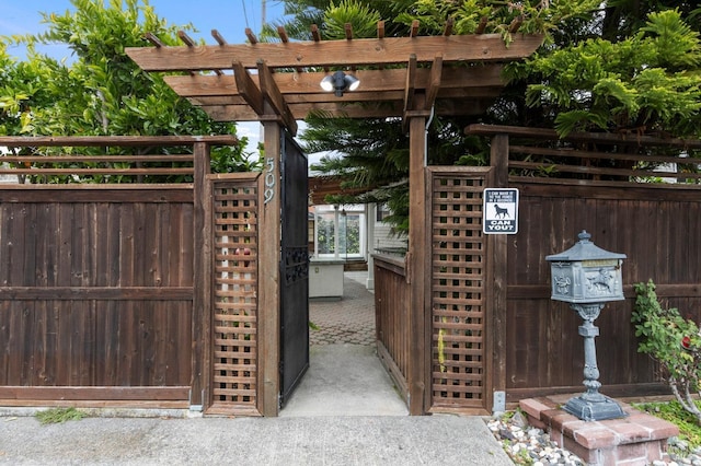 view of gate featuring a pergola