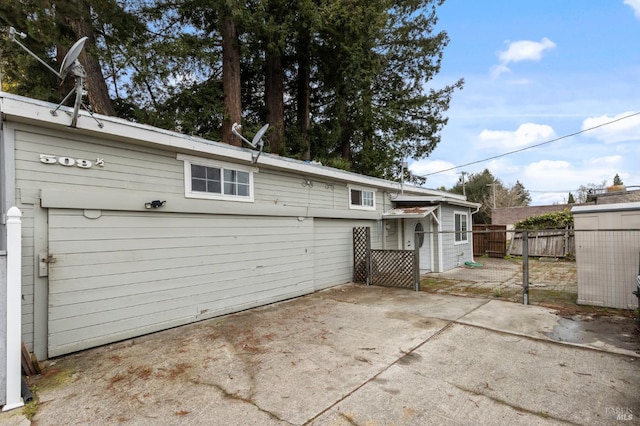 back of house with a patio area and fence