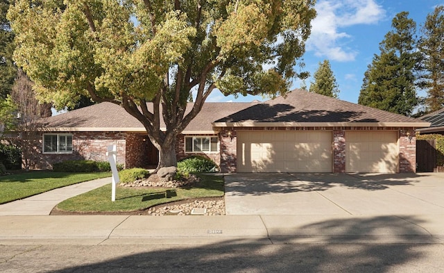 ranch-style house featuring concrete driveway, brick siding, a garage, and a front lawn