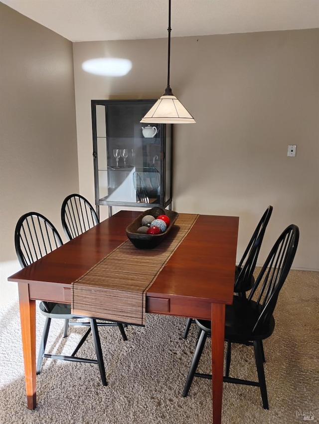 dining area featuring carpet