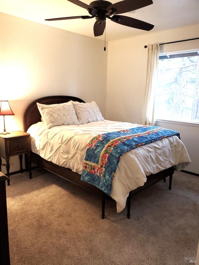 carpeted bedroom featuring a ceiling fan