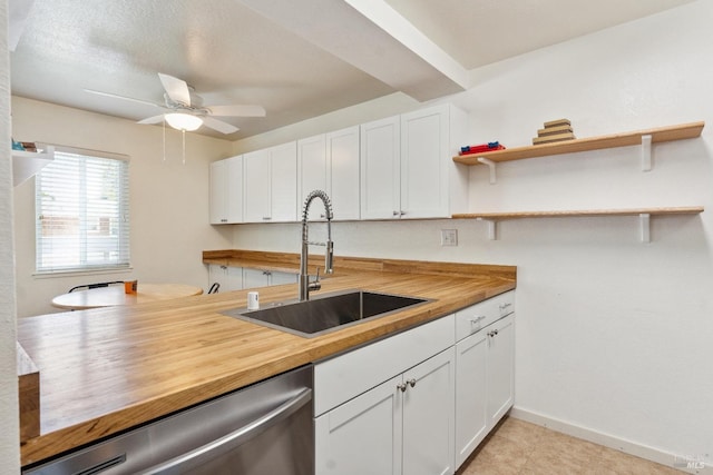 kitchen featuring a sink, open shelves, butcher block countertops, and dishwasher