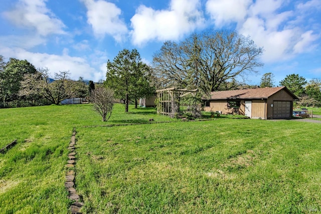 view of yard with a garage