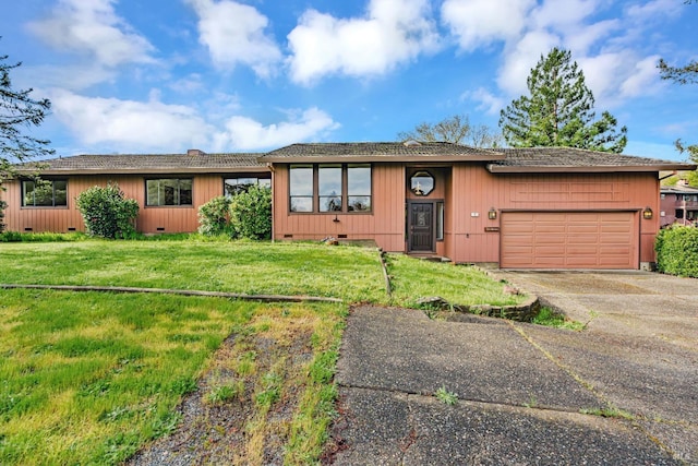 ranch-style house with crawl space, driveway, an attached garage, and a front lawn