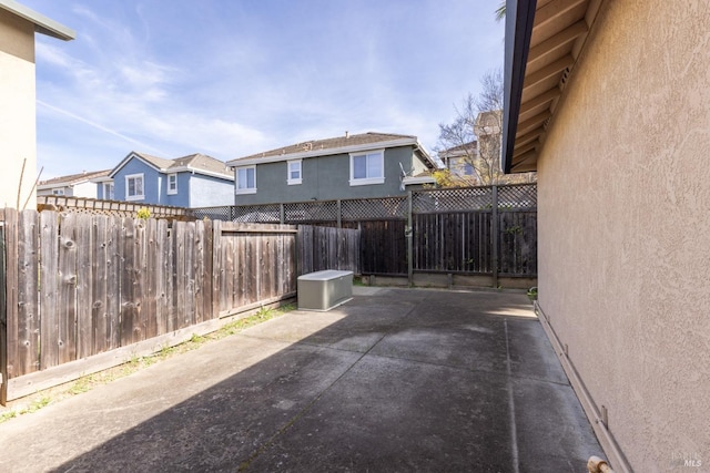 view of patio / terrace featuring a residential view and a fenced backyard