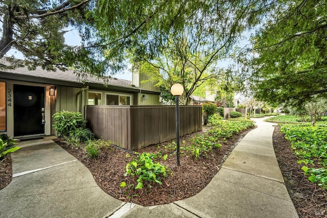 exterior space featuring fence and board and batten siding