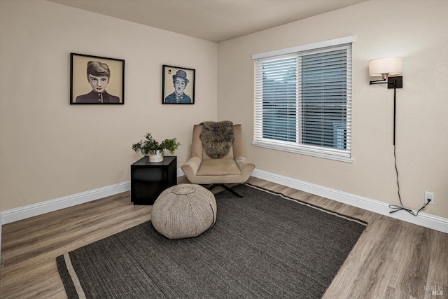 sitting room featuring wood finished floors and baseboards