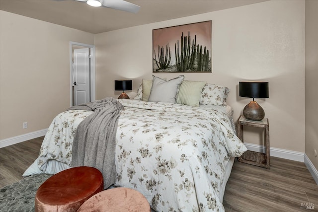 bedroom featuring ceiling fan, baseboards, and wood finished floors