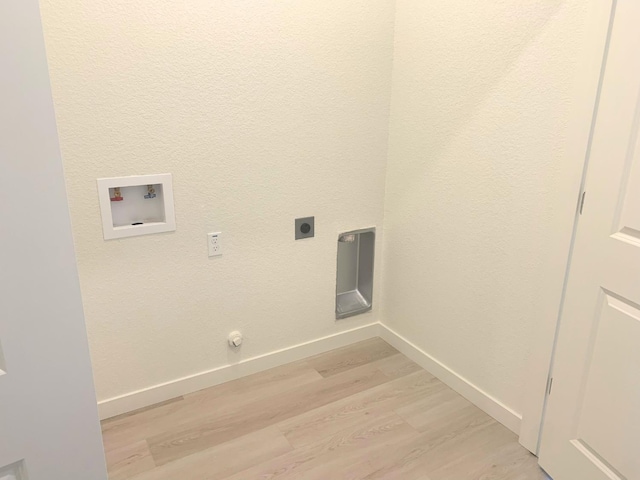 laundry room featuring electric dryer hookup, baseboards, light wood-style floors, and washer hookup