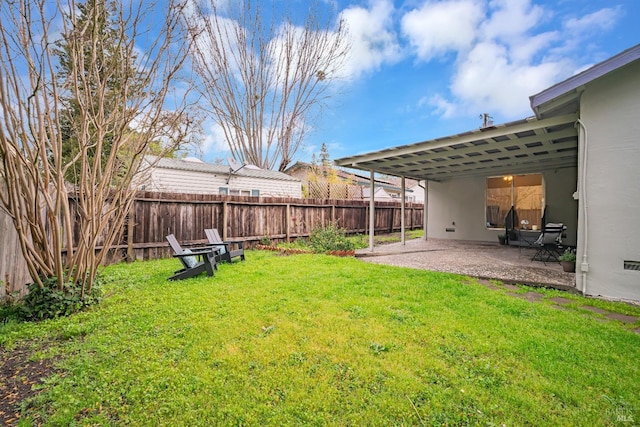 view of yard featuring a patio area and fence