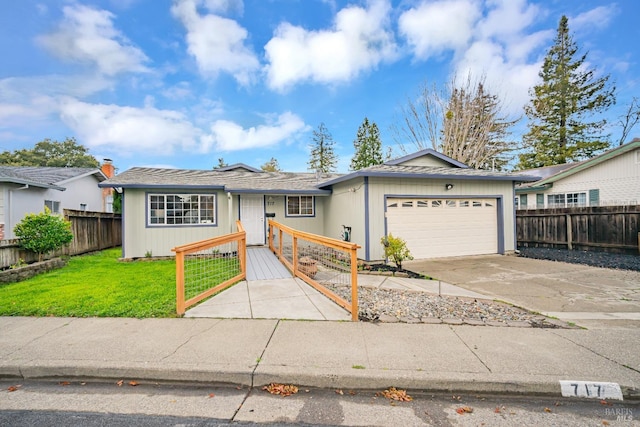 single story home featuring a front yard, driveway, a garage, and a fenced front yard