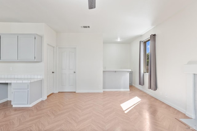 interior space featuring visible vents and baseboards