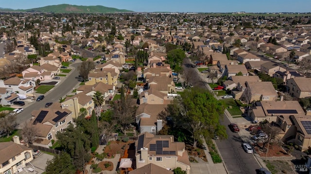 birds eye view of property with a residential view and a mountain view