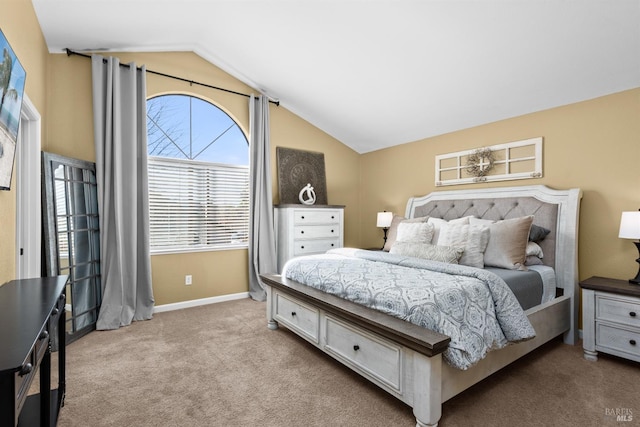 bedroom featuring carpet flooring, baseboards, and vaulted ceiling