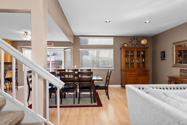 dining area featuring recessed lighting, baseboards, light wood-style flooring, and stairs