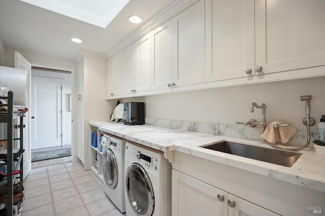 washroom with washer and clothes dryer, recessed lighting, a sink, light tile patterned flooring, and cabinet space