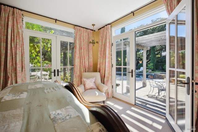 unfurnished sunroom with french doors