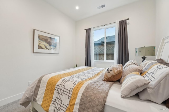 carpeted bedroom featuring recessed lighting, baseboards, and visible vents