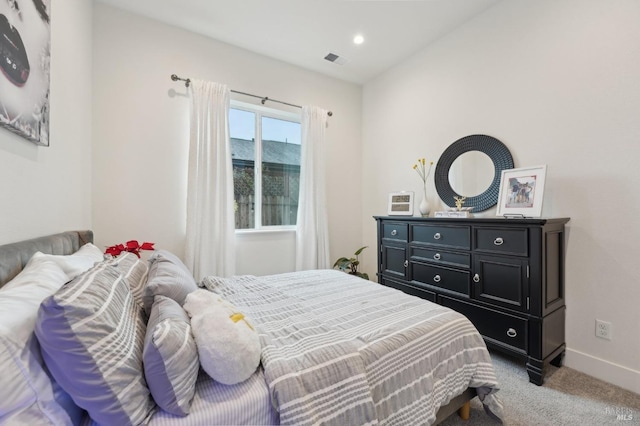 carpeted bedroom with recessed lighting, visible vents, and baseboards