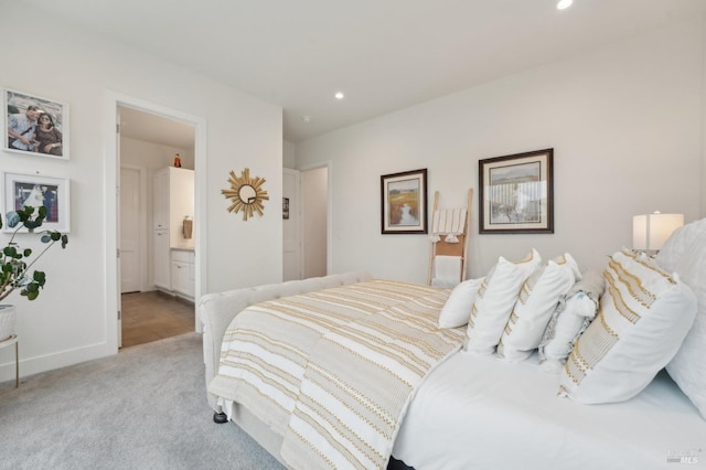 bedroom featuring carpet flooring, recessed lighting, baseboards, and ensuite bathroom