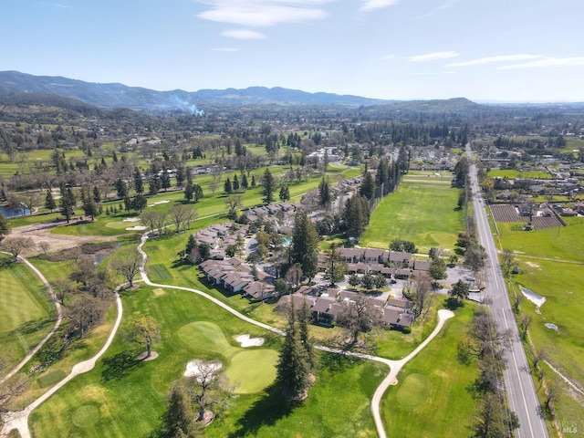 bird's eye view featuring a mountain view and view of golf course