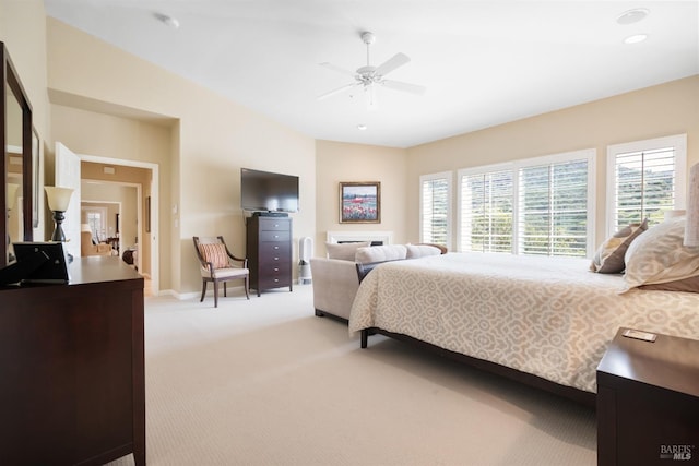 bedroom with recessed lighting, light colored carpet, baseboards, and ceiling fan