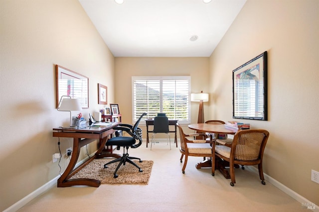 carpeted office space with baseboards