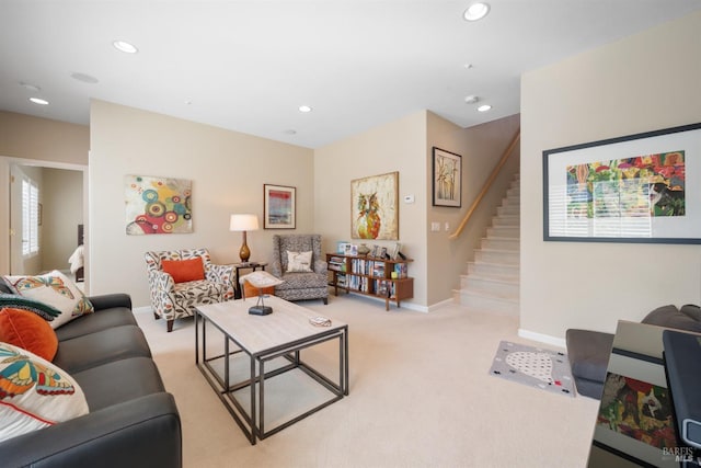 living room with recessed lighting, stairway, light colored carpet, and baseboards