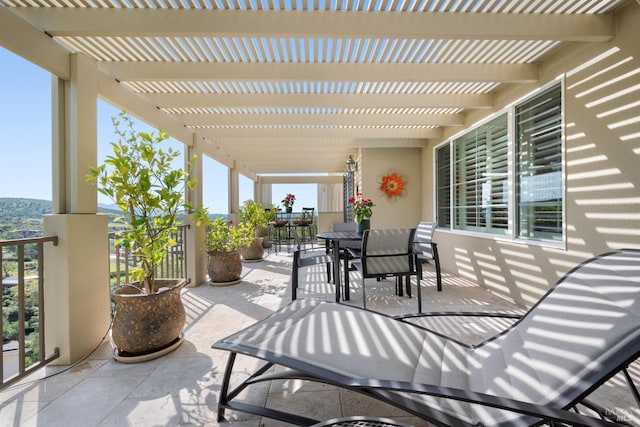 view of patio / terrace featuring outdoor dining area and a pergola